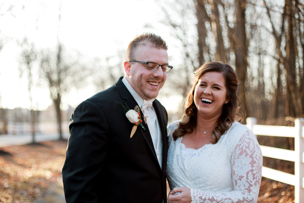 bride and groom laughs