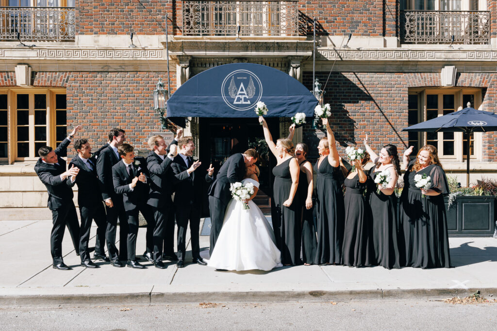 bridal party celebrating infront of the Athletic Club Wedding venue