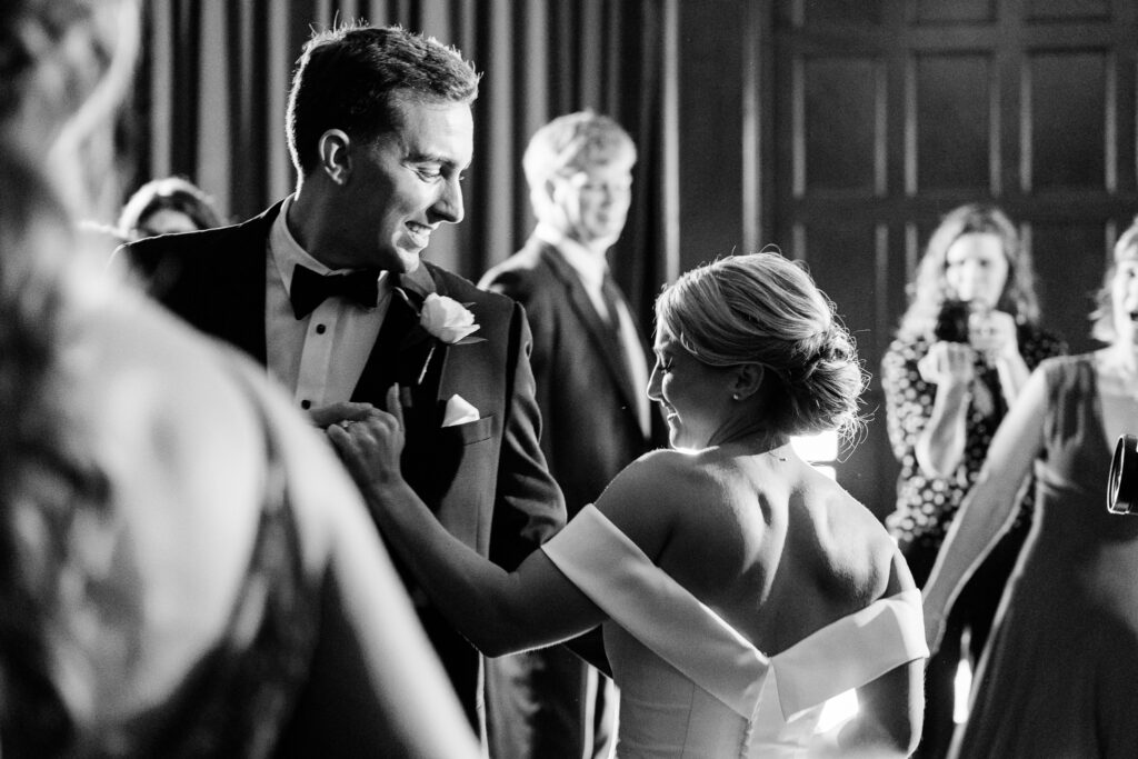 black and white photograph of bride and groom dancing on their wedding night