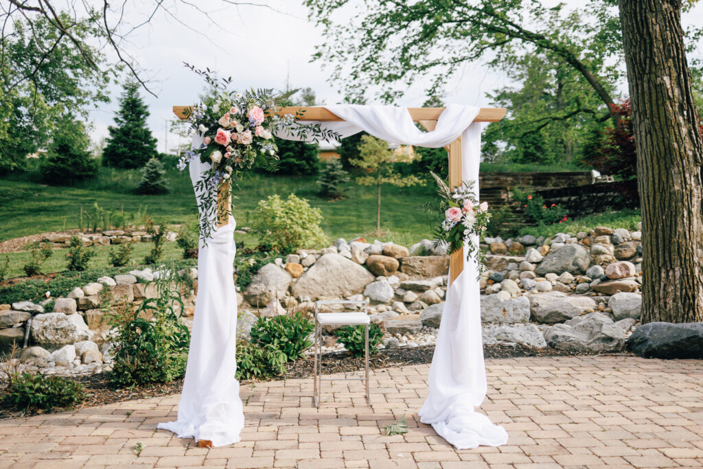 wedding ceremony arch with florals