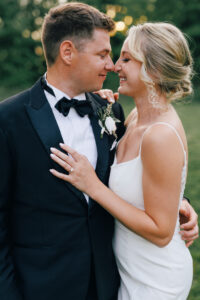 bride and groom hug and touch noses