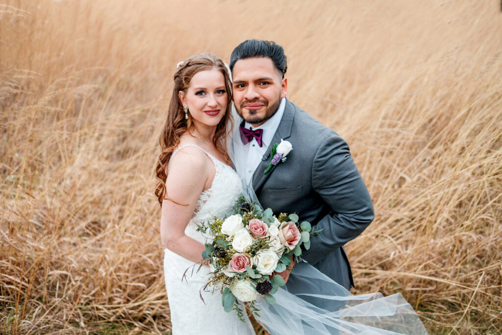 bride and groom portrait in field at Brookshire Event Center