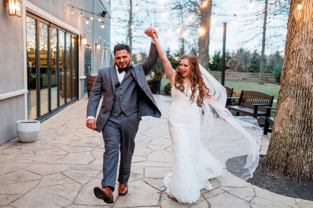 bride and groom celebrate on the grounds of Brookshire Event Center