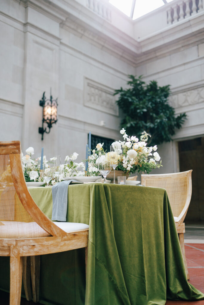 Styled Green velvet wedding table in marble room at the Columbus Art Museum wedding venue