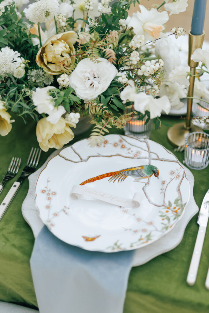 tables cape with green velvet setting and floral plate styled by wedding planner