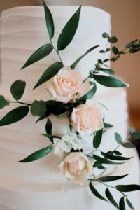 wedding cake with greenery at the Columbus Atheneum