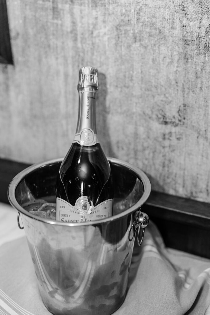 Champagne in silver bucket at wedding at the leveque hotel