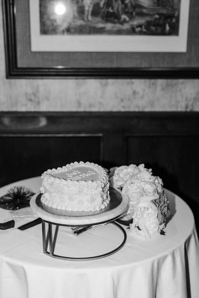 intimate cake table at wedding at leveque hotel