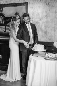 bride and groom cut cake at the leveque hotel