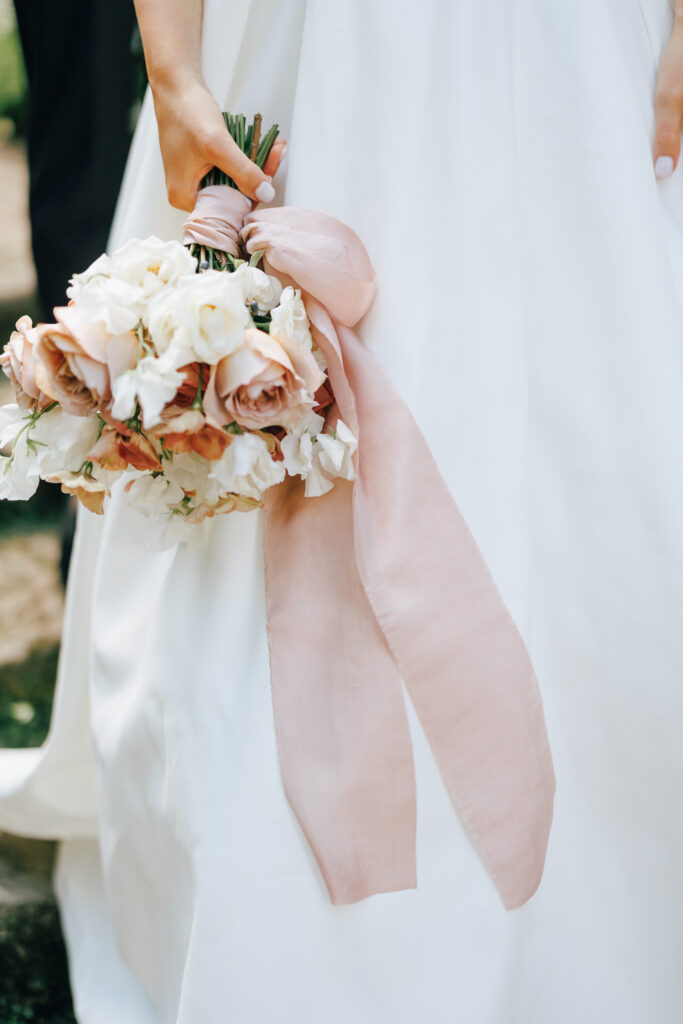 wedding bouquet of peaches white and blush captured by luxury wedding photographer in columbus ohio